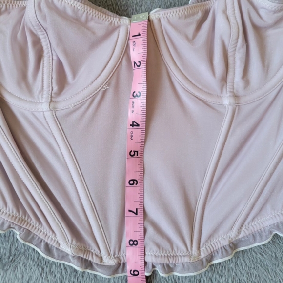 out from under pastel pink and white corset top - Picture 4 of 4